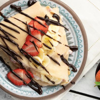 Image of Chocolate-Strawberry-Banana Crepes with Raspberry Sauce