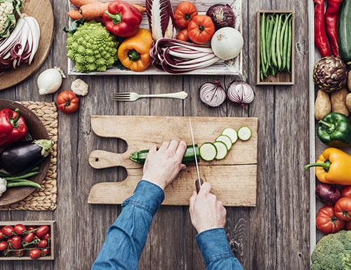 Image of chef cutting cucumber